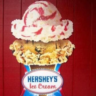 The Hershey's Ice Cream sign on the coach's red siding, a two-scoop cone painted above it