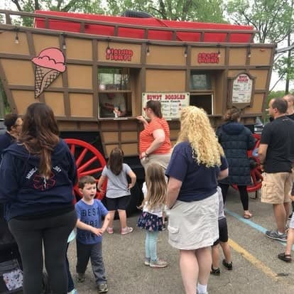 Families lined up at the coach's service window